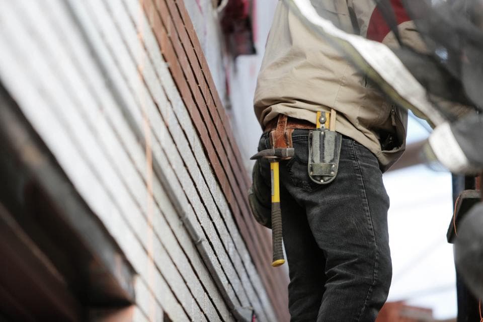 Technician's tool belt on the job